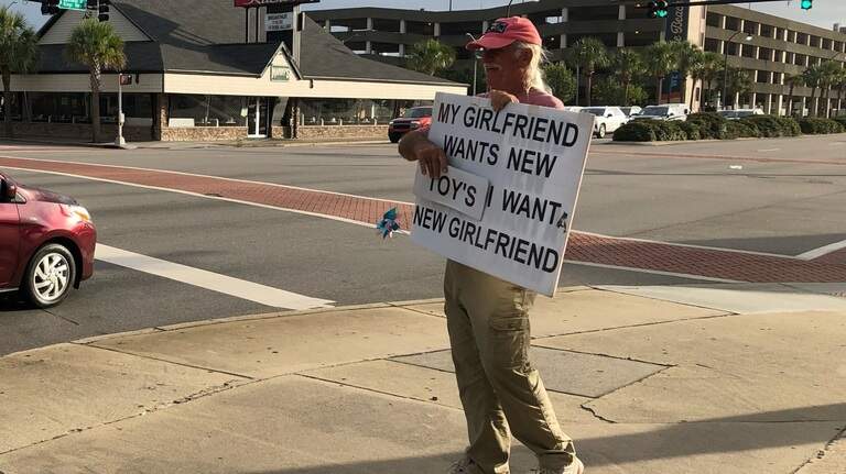 ‘My girlfriend wants new toys.’ Meet the man with a provocative sign in the Myrtle Beach area