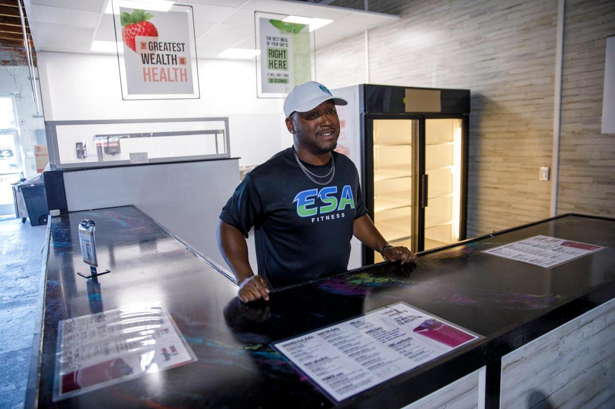 Terrance Buter, manager of ESA fitness stands at the counter of a new smoothie cafe’ inside the gym. Oct. 25, 2024.