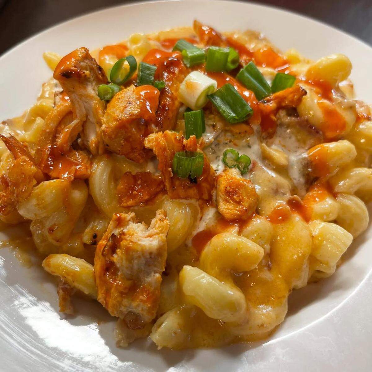 Gator Zone Sports Bar & Grille’s food menu offers signature dishes like the beer cheese buffalo chicken mac.
