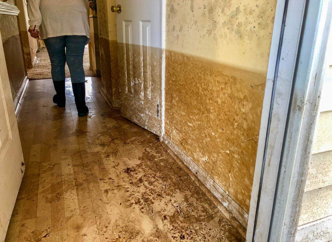 Water levels can be seen on the wall in Lee Manuel’s apartment Monday at Aberdeen Country Club.