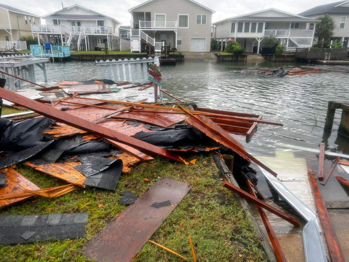 Portions of a roof lay scattered in the canals of Hog Inlet in North Myrtle Beach S.C. after a tornado damaged roofs near 56th Avenue North in North Myrtle Beach, S.C. Hurricane Idalia was downgraded to a tropical storm after hitting the gulf coast of Florida on Wednesday but brought heavy rains, coastal flooding and tornados to the South Carolina coastline. Aug. 31, 2023.