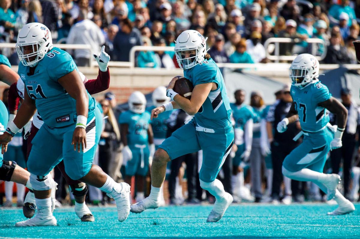 Coastal’s Grayson McCall runs the ball against Texas State after missing last week due to injury. Coastal Carolina played Texas State in college football. The Coastal Carolina Chanticleers played the Texas State Bobcats in a Sun Belt Conference NCAA FBS college football game in Conway SC. Nov. 20, 2021.