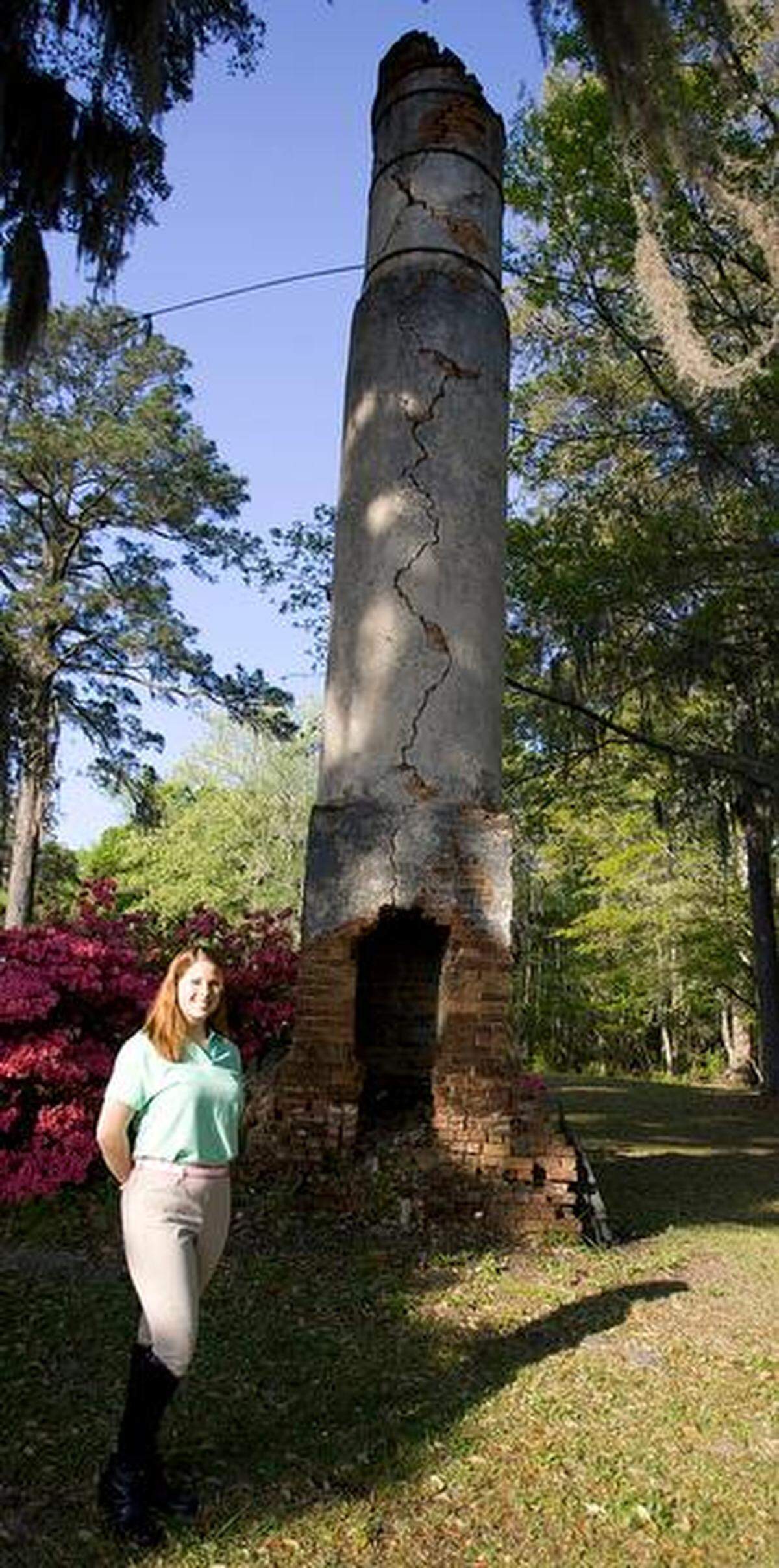Susanna Buck Register says the chimney is part of the first steam operated lumber mill in America on the grounds of Upper Mill Plantation outside of Conway on Friday, April 8, 2011. The Bucks established the plantation in 1828 after Capt. Henry Buck moved to the area from the north. The plantation is the site of the first steam operated lumber mill in America. Susanna Buck Register said her ancestors actually paid the slaves on the plantations they owned. The Bucks also held Middle Mill, which is now at Bucksville Landing, and Lower Mill, which is in Bucksport. The plantations produced lumber for ship building, cypress shingles, cotton, rice, sweet potatoes and corn. According to the Horry County Historical Society, there were 133 slaves on the plantation in 1850. Ten years later, there were 312 slaves. Susanna Buck Register said slaves used to lay on the front porch, out of sight from the Buck family, to listen for updates about the Civil War. The Civil War began on April 12, 1861, and ended April 9, 1865. In those four years, an estimated 620,000 soldiers died. Photo by Janet Blackmon Morgan / jblackmon@thesunnews.com