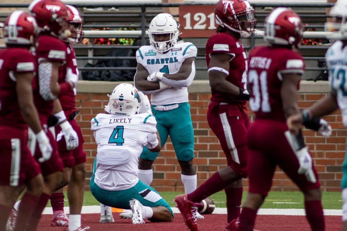 Coastal Carolina tight end Isaiah Likely (4) celebrates a touchdown with Coastal Carolina running back CJ Marable (1) against Troy during an NCAA college football game, Saturday, Dec. 12, 2020, in Troy, Ala. (AP Photo/Vasha Hunt)