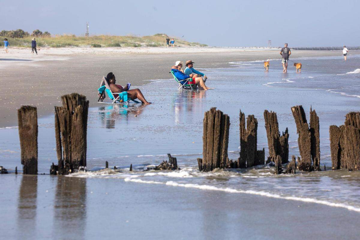 Wooden groins, battered by ocean waves and exposed by shifting sands along Folly Beach have fallen into disrepair. Shifting sands are having opposite effects on some Charleston area beaches with erosion claiming the Folly Beach shoreline while Sullivan Island’s beach is growing. July 21, 2022.