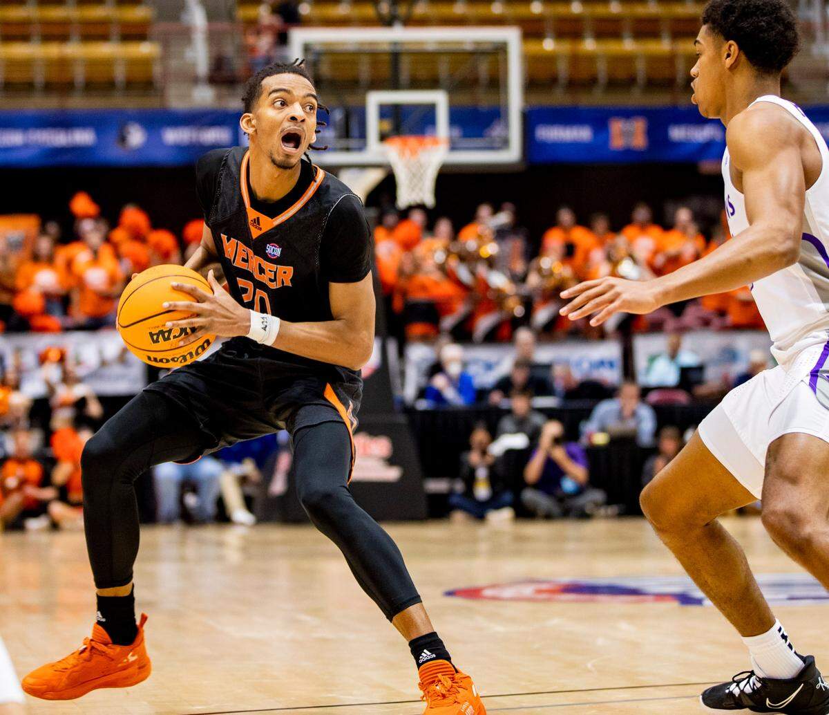 Mercer graduate student guard Jalen Johnson looks to pass against Furman Saturday afternoon in the SoCon Ingles Basketball Championships at the Harrah’s Cherokee Center in Asheville, N.C.