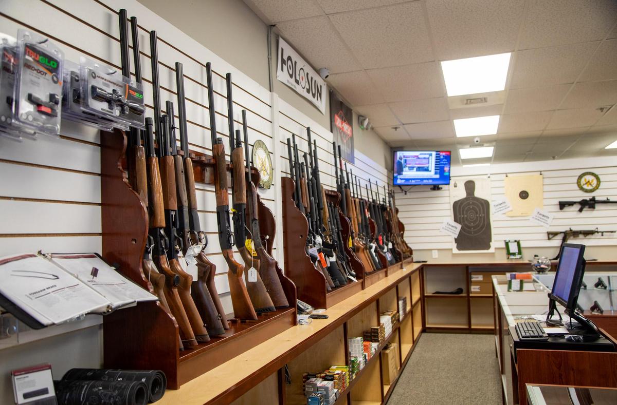 Rifles and shotguns line the walls of Cormac Arms & Outfitters on 38th Avenue in Myrtle Beach.. In addition to gun sales and apparel, the new tactical shop supplies law enforcement agencies with tactical gear.