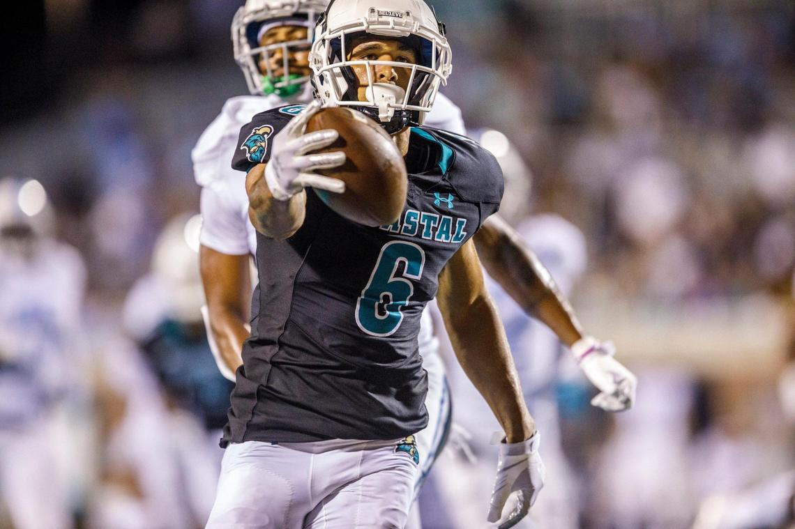 Coastal’s Jaivon Heiligh drives for a touchdown at the end of the first half. Coastal Carolina University hosted The Citadel in game one of the 2021-22 season. Aug. 11, 2021.