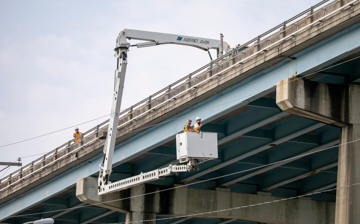 Members of the South Carolina Department of Transportation inspect the U.S.17 span bridge over the Intracoastal Waterway in North Myrtle Beach. Falling concrete forced closure of the Johnny Causey boat landing under the bridge on March 27. Officials hope the bridge can be repaired and the landing open in the next week.