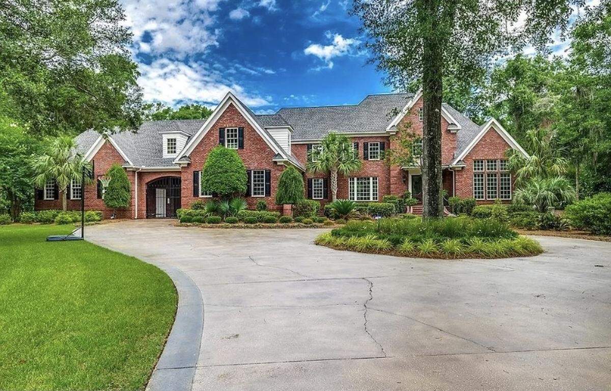 An expensive home is for sale in Pawleys Island, SC. The house is listed on Zillow for $2.9 million. It features a spacious outdoor area with a pool and cabana.