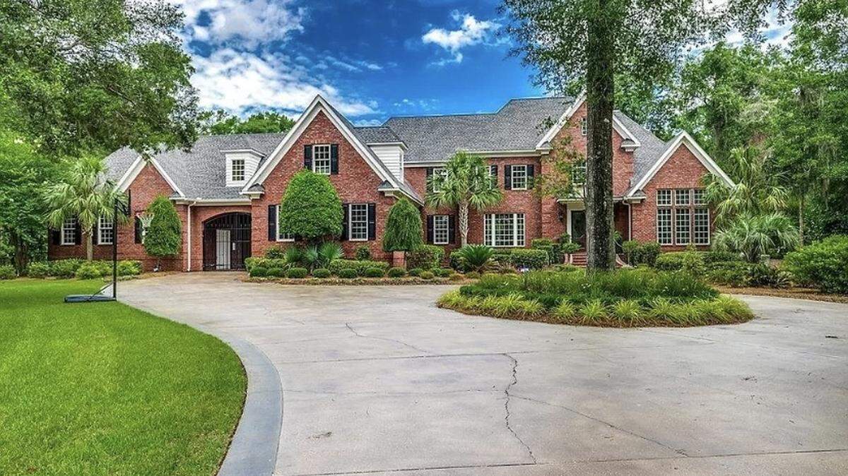 An expensive home is for sale in Pawleys Island, SC. The house is listed on Zillow for $2.9 million. It features a spacious outdoor area with a pool and cabana.