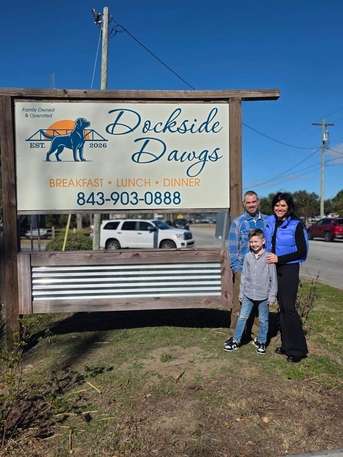 Chris and Brianna Throckmorton, along with their son Liam, stand outside their new restaurant Dockside Dawgs along Dick Pond Road in the Socastee area. The couple recently purchased the historic Cooper House and general store and will operate a wedding and rental venue in the buildings.