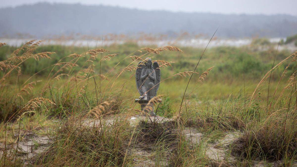 An angel statue in the dunes at Cherry Grove Point in North Myrtle Beach. The statues placed there over the years have become a memorial, offering comfort for those who come to visit. A family has even spread a loved one’s ashes in the dunes. Aug. 31, 2023.