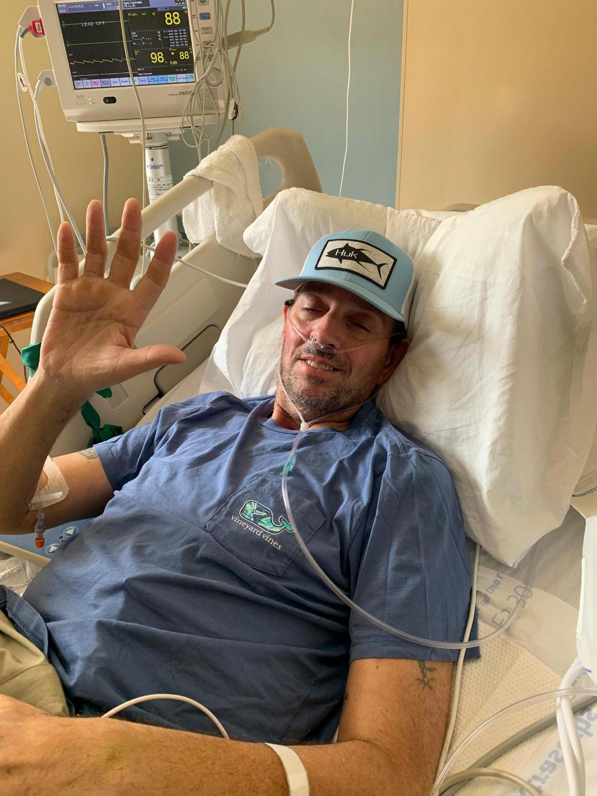 In a submitted photo, Chad Hardee waves to friends in his first day back in regular clothes. May 3, 2021.