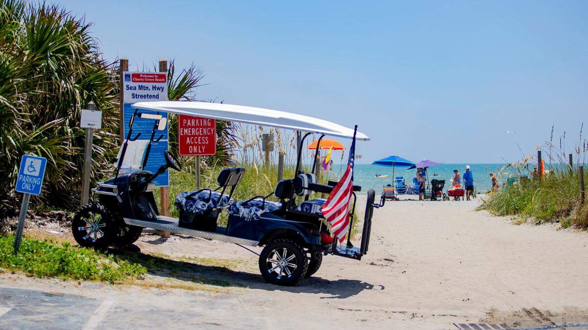 A golf cart sits parked at the Sea Mountain Highway beach access Sunday afternoon in Cherry Grove in August 2020. It is illegal to drive golf carts on the beach in the Myrtle Beach area.