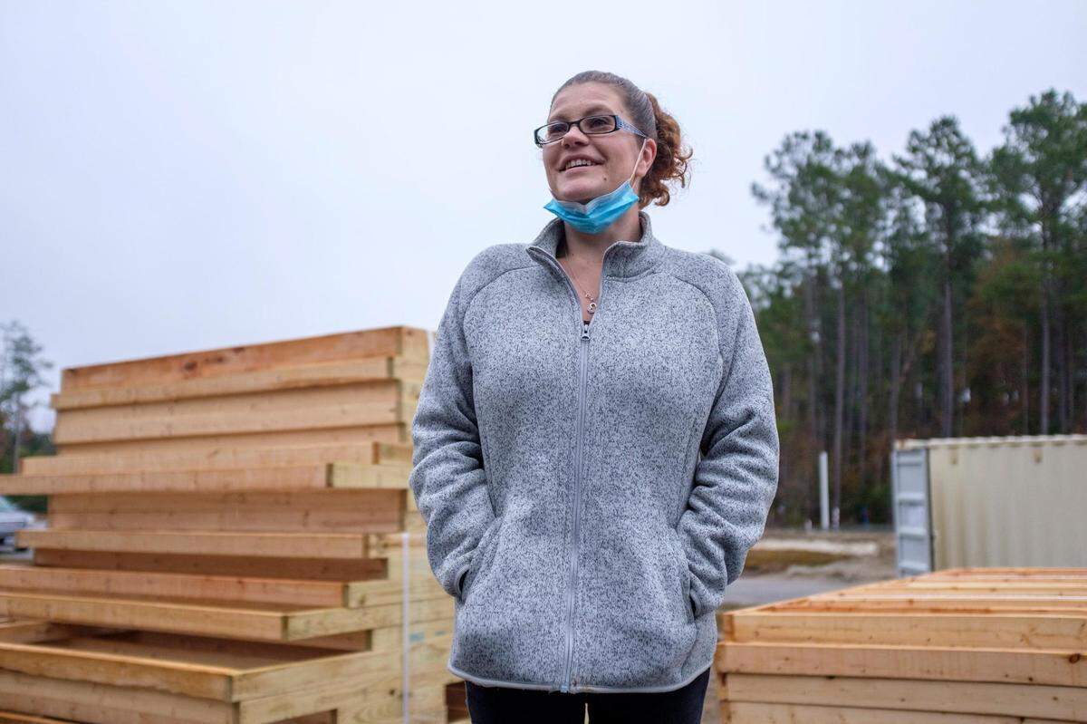 Kimberly Miller and her six-year-old son Tanner Ray attend a ground breaking of their new Habitat for Humanity home near Conway, S.C. December 16, 2020.