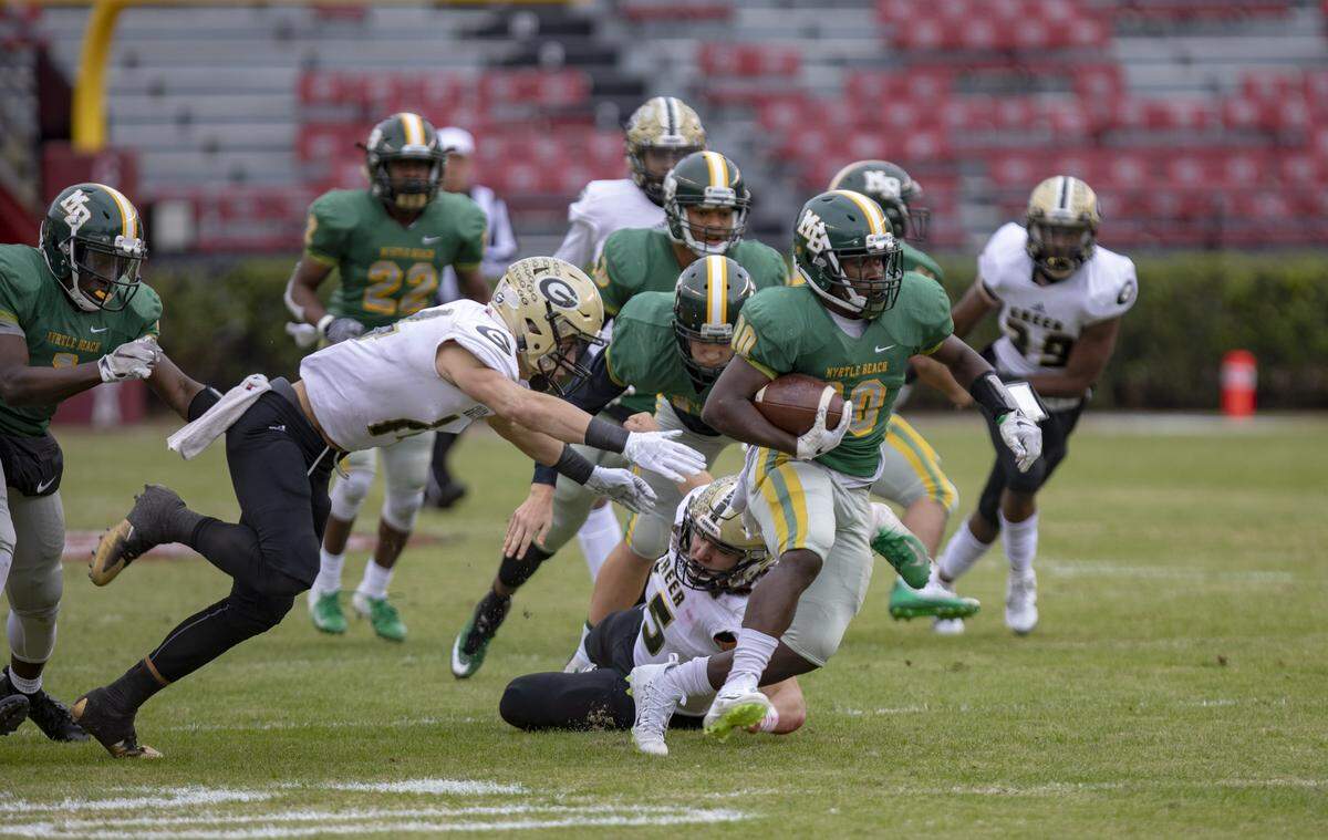 Myrtle Beach senior running back Jermani Green returns a kick at Williams-Brice Stadium in Columbia as the Myrtle Beach Seahawks take on the Greer Yellow Jackets in the AAAA State Championship game Friday afternoon.