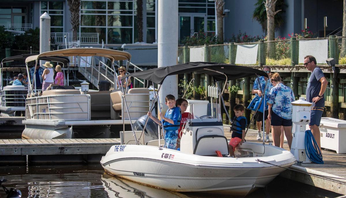 Members of Freedom Boat club load up at Harbourgate marina for a day on the water in North Myrtle Beach. The boat club, which maintains a fleet of vessels in three Myrtle Beach area locations, has experienced record membership growth due in part to low dealer inventories and post-pandemic interest in boating. Aug. 3, 2022.