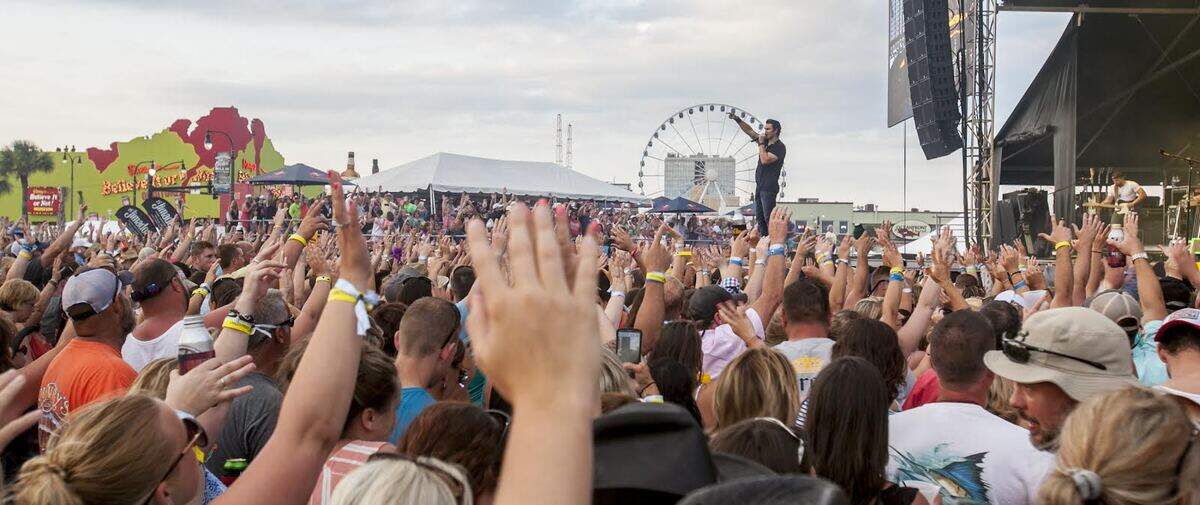 Joe Nichols performs on stage at ocean front in Myrtle Beach for The Carolina Country Music Fest 2016 on Friday in Myrtle Beach. Friday’s festival included crowds of thousands from around the country with games, food, vendors and performances major country artists.