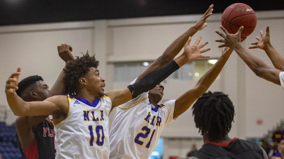 North Little Rock (AR) senior guard Collin Moore grabs for a rebound against Florence (MS) in the 2018 Beach Ball Classic Wednesday at the Myrtle Beach Convention Center.