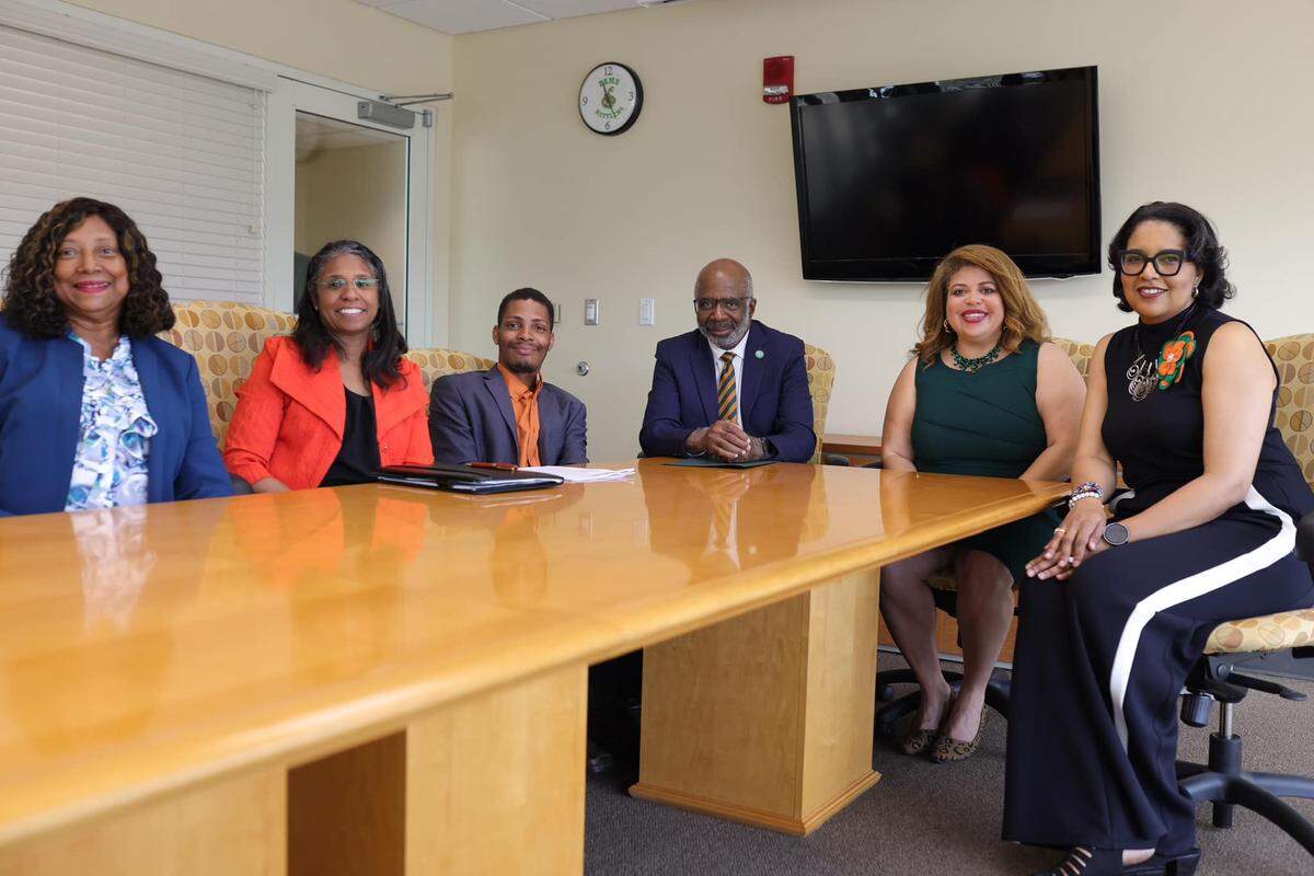 Gregory Gerami, third from left, poses for a photo with officials from Florida A&M University after announcing a historic $237 million donation to the school. After public skepticism about the wealth of the Texas hemp farm company CEO, officials have admitted the gift may be worthless, and Shawnta Friday-Stroud (second from left) resigned as vice president for university advancement.