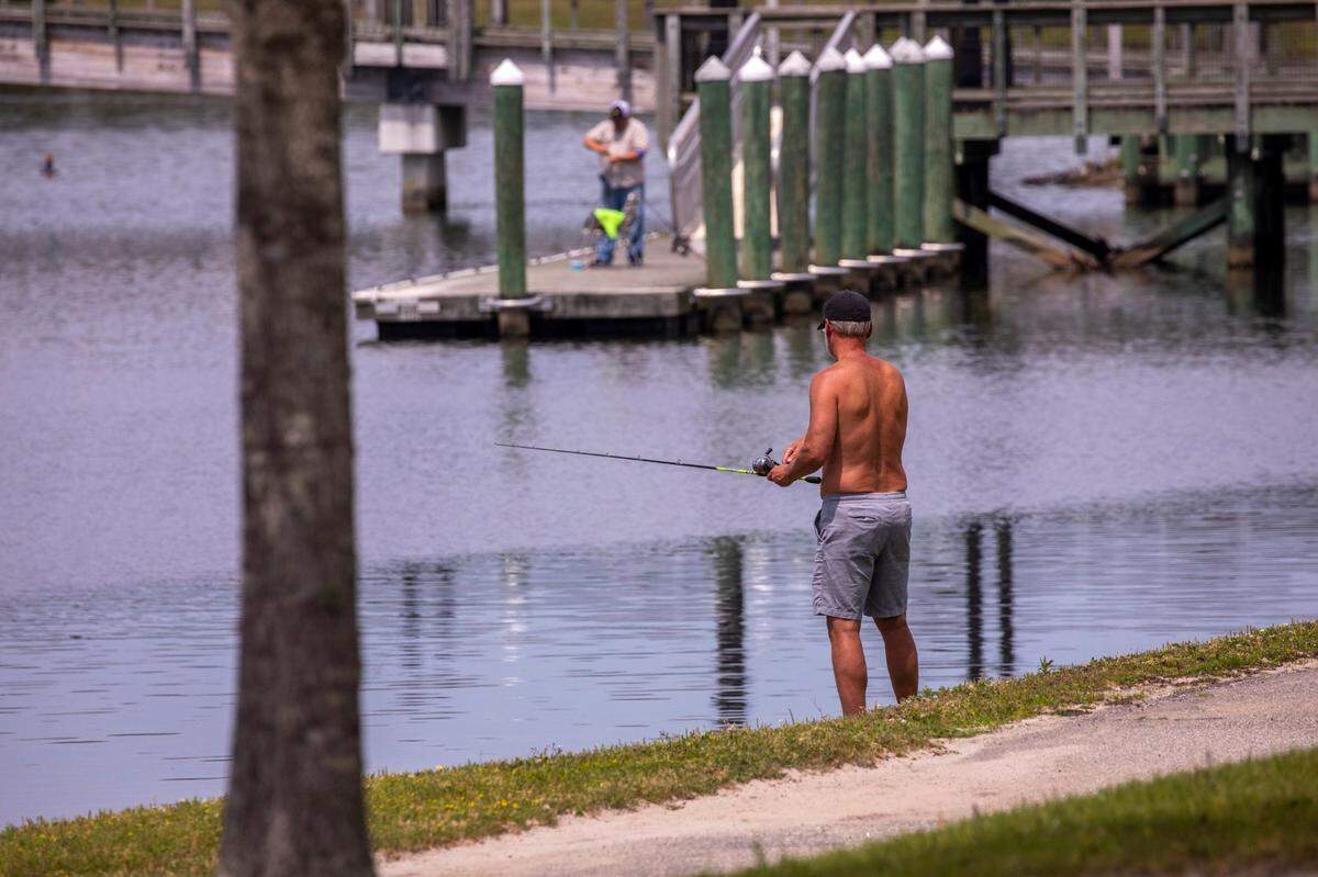 Fisherman try their luck at Market Common’s Grand Lake.. April 7, 2020. TSN FILE