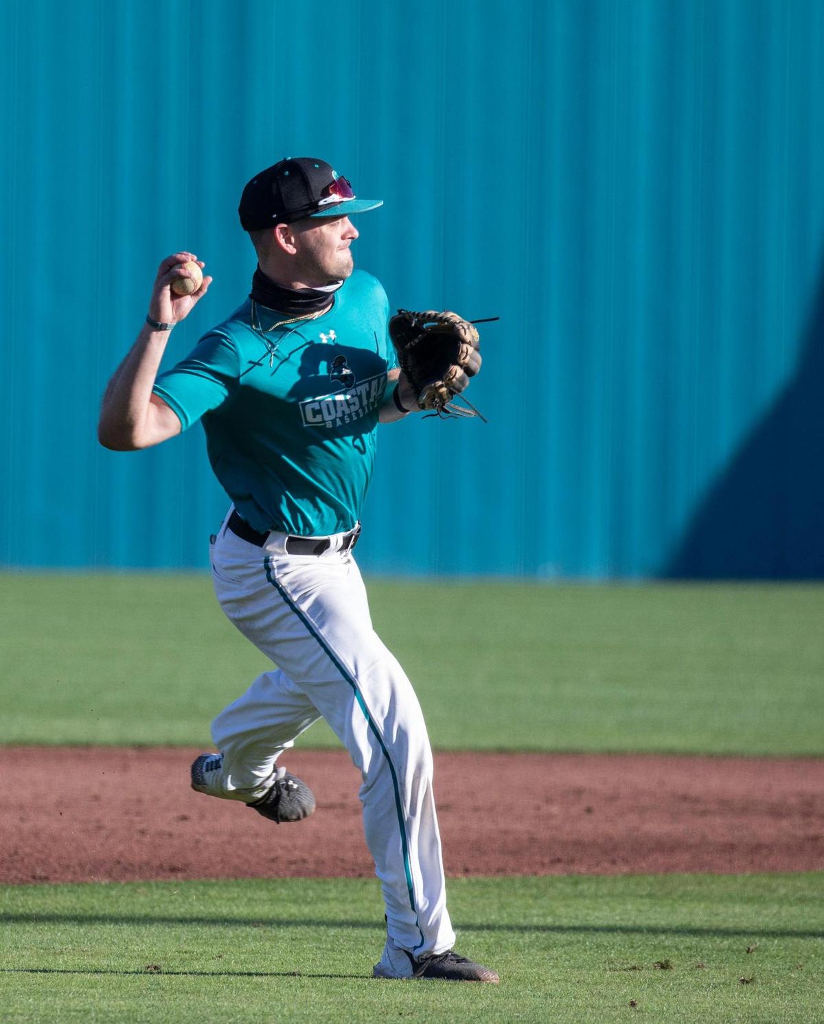 Coastal’s Brady Moore fields the ball during practice. The Coastal Carolina baseball team had its first full day of practice Friday at Springs Brooks Stadium in preparation for the 2021 season, which begins Feb. 19-21 with a three-game series against Duke at home. January 29, 2021.