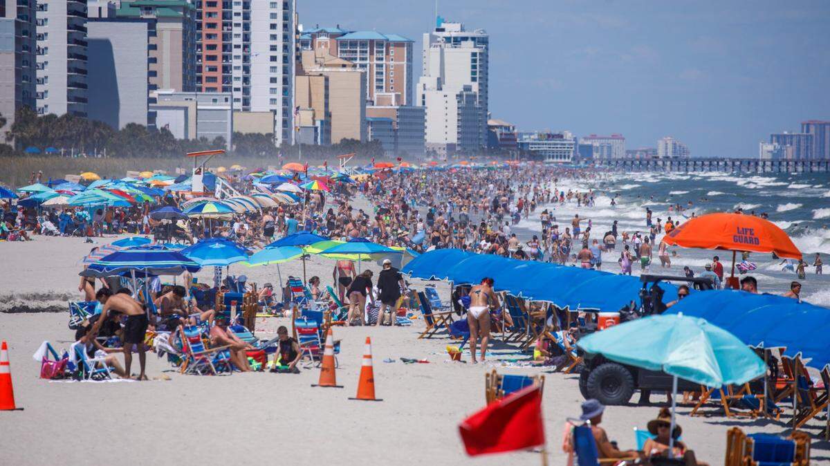 View from the Springmaid Pier looking North at swimmers and sunbathers in Myrtle Beach on Tuesday. The week of July 4th is one of the times for tourism in the Myrtle Beach area. July 2, 2024.