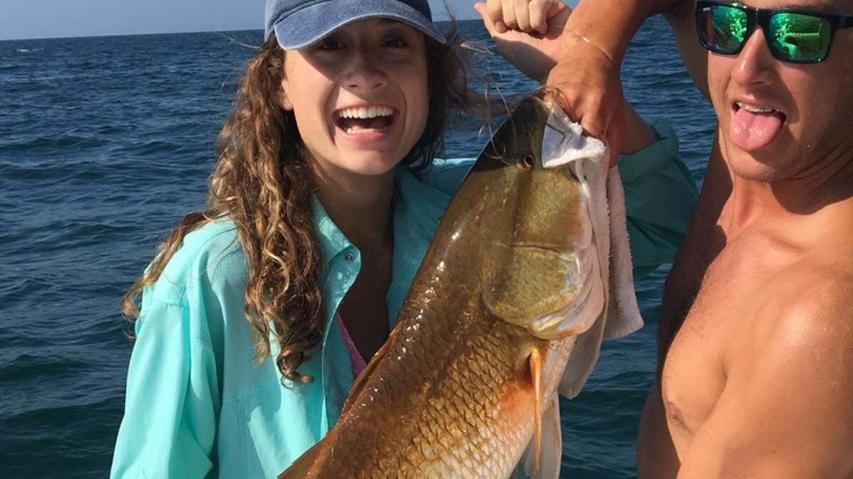 Hannah Nash shows off a bull red drum she caught and released this week in the Surfside Beach vicinity.