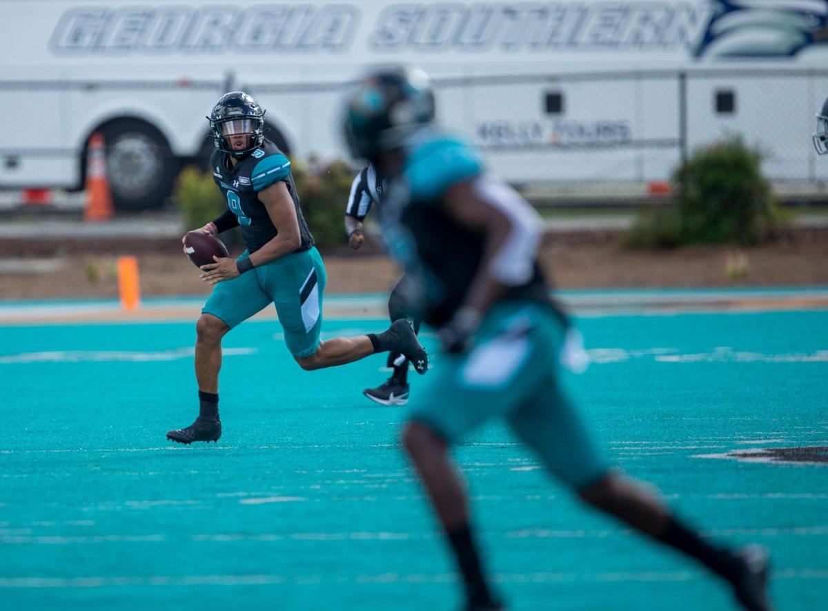 Coastal’s Fred Payton looks downfield for a receiver. Coastal Carolina played its first game as a ranked FBS team against Georgia Southern on Saturday at Brooks Stadium in Conway. October 24, 2020.
