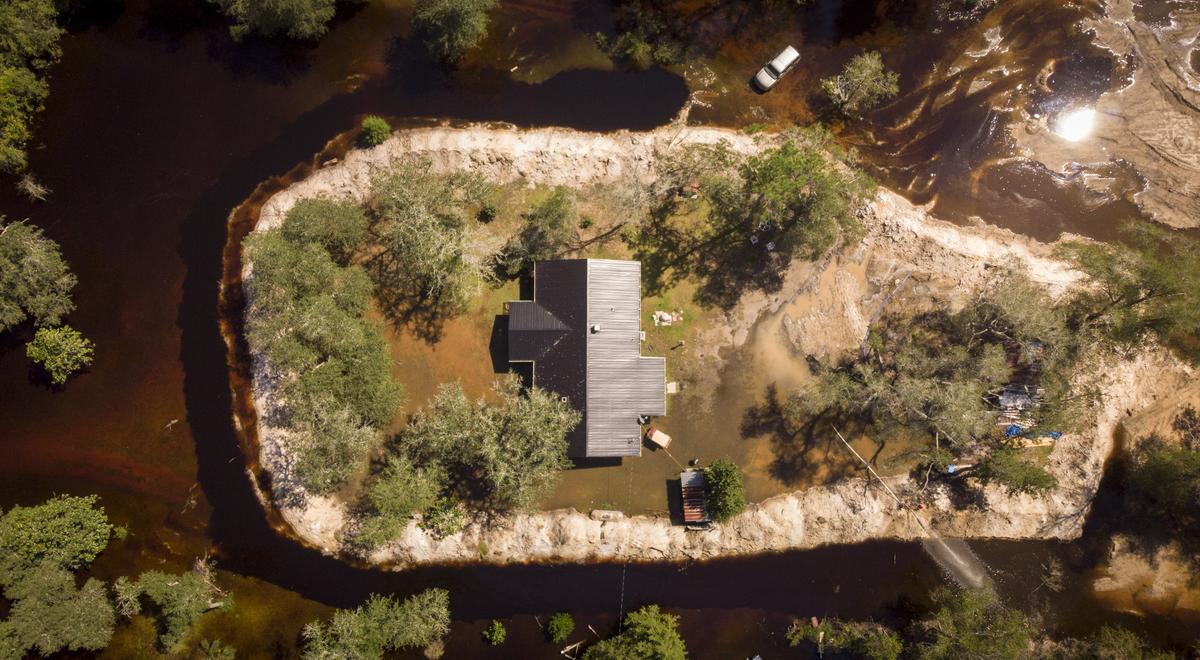 Rodney Hyman had to rebuild his home hear Galivants Ferry after floodwaters from Hurricane Matthew caused extensive damage two years ago. This time, he used an excavator to build an eight foot tall wall of dirt around his home to protect it from the Pee Dee River.