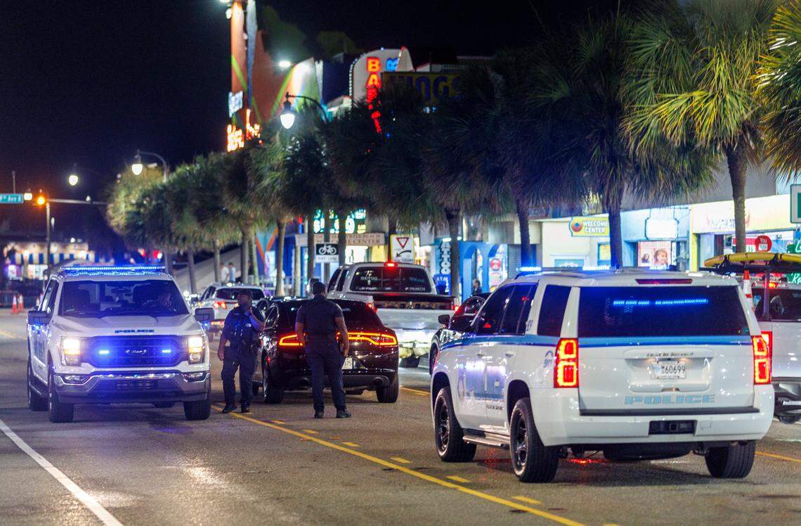 Myrtle Beach police officers maintain a presence along Ocean Boulevard in Myrtle Beach on Friday, May 30, 2025.