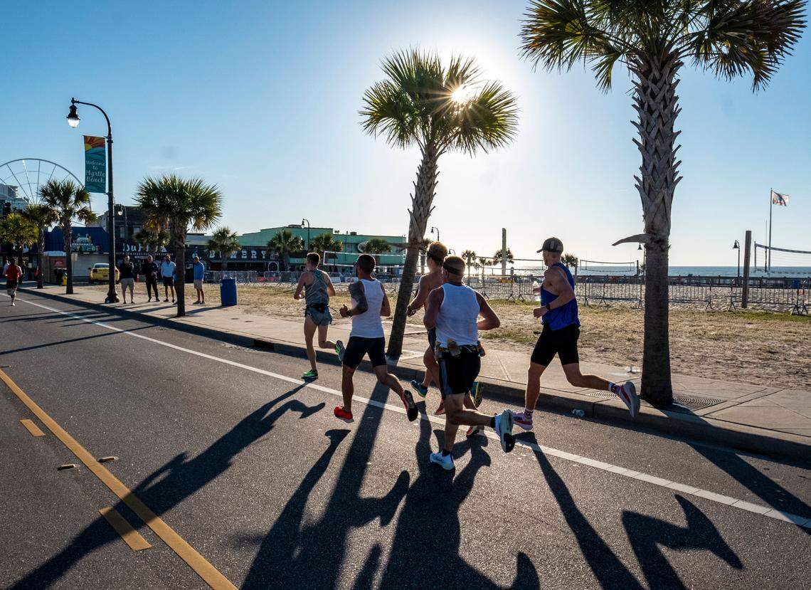A group of runners pass a largely empty boardwalk on Ocean Boulevard. After being canceled in 2020 due to COVID-19 the Myrtle Beach Marathon was held Saturday, May 1, 2021 with new safety precautions. Myrtle Beach hosted approximately 4,000 runners in full marathon, half marathon and 5-kilometer races. May 1, 2021.