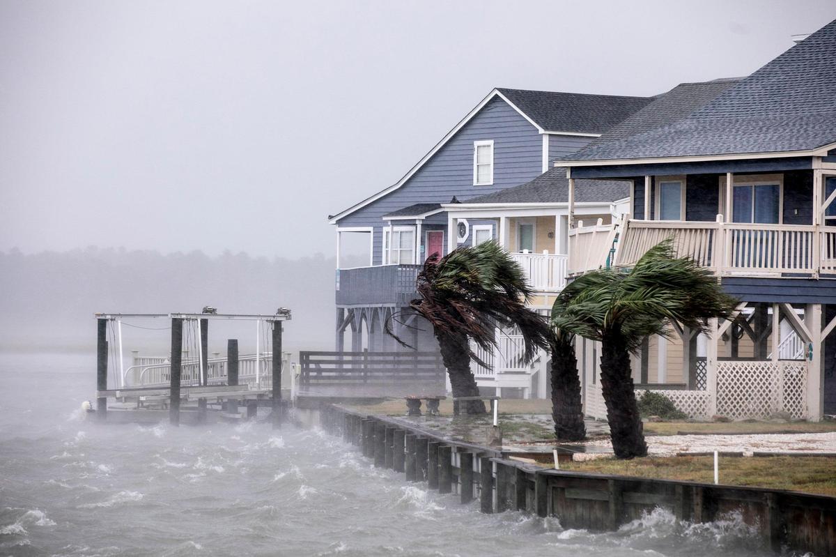 Waves lash a seawall at Cherry Grove in North Myrtle Beach. The effects of Hurricane Florence hit the area the morning of Friday, September 14, 2018. South Carolina is increasingly feeling the effects of the changing climate.