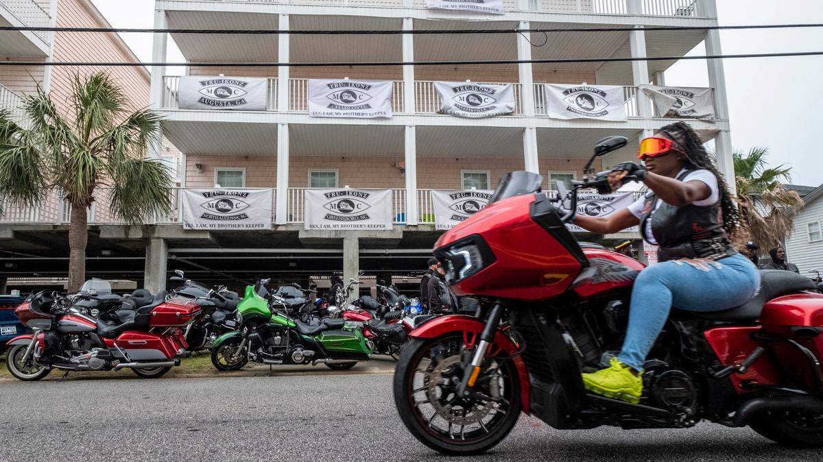 The motorcycle club “Tru Ikonz,” host a party in the garage of their condo on Ocean Boulevard in North Myrtle Beach, S.C. Unseasonably cool temperatures and drenching rains put a damper of Atlantic Beach Bike Week on Friday, but bikers packed into garages around North Myrtle Beach for holiday parties. May 26, 2023.
