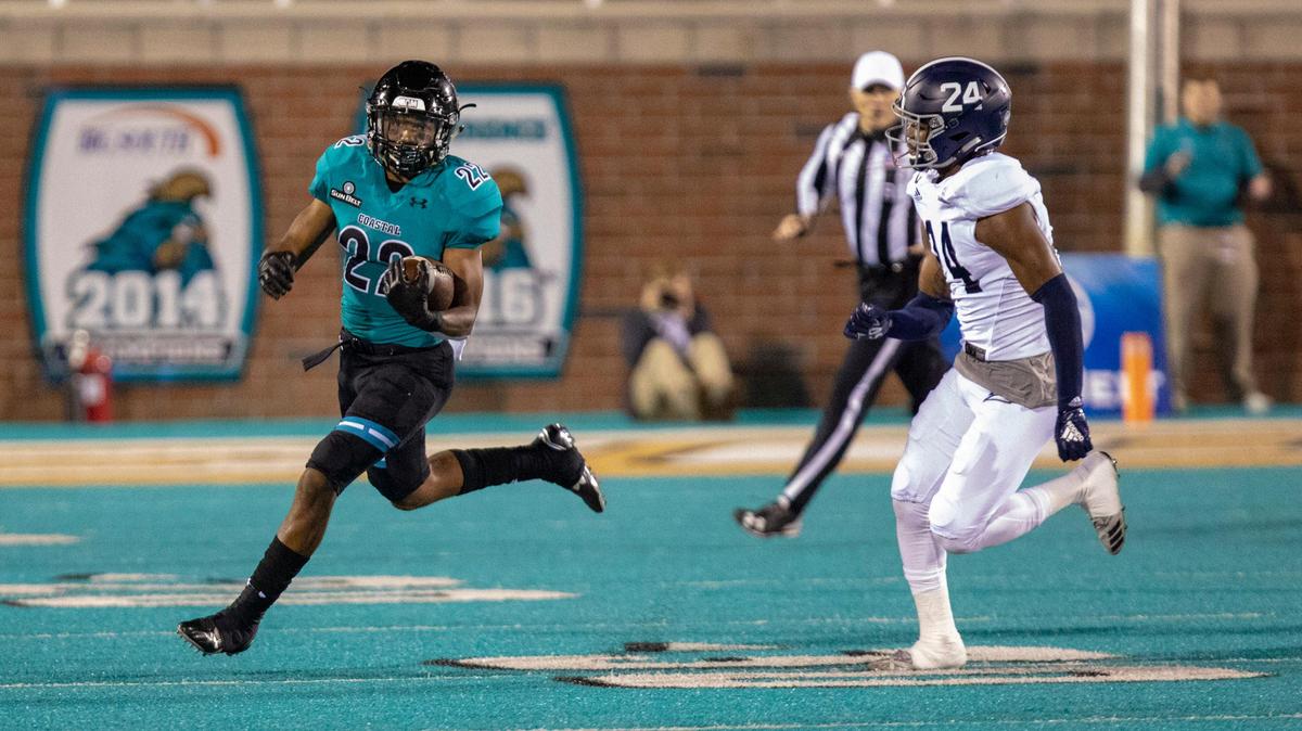 Coastal Carolina sophomore running back Alex James runs the ball against the Georgia Southern Eagles on Saturday night at Brooks Stadium in Conway.