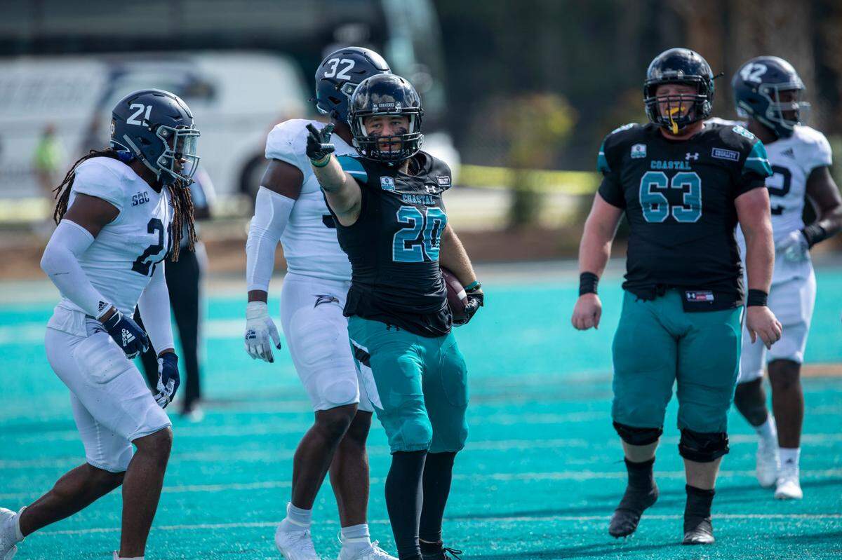 Coastal’s Greg Latushko signals a first down after a pass reception in the fourth quarter against Georgia Southern. Coastal Carolina played its first game as a ranked FBS team against Georgia Southern on Saturday at Brooks Stadium in Conway. October 24, 2020.