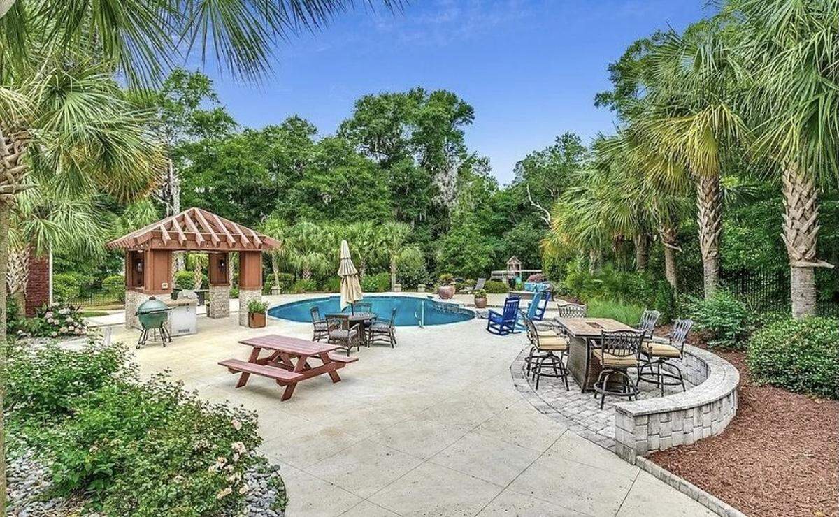An expensive home is for sale in Pawleys Island, SC. The house is listed on Zillow for $2.9 million. It features a spacious outdoor area with a pool and cabana.