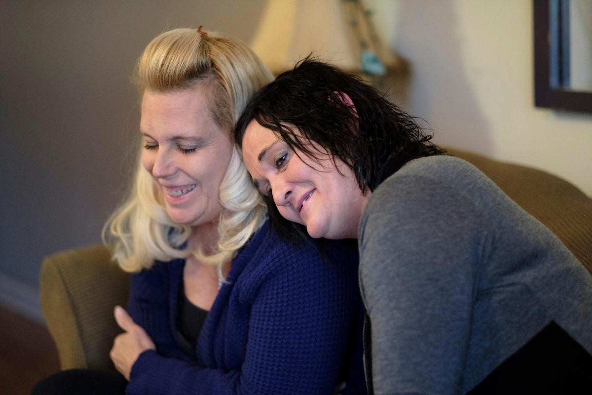 Amber Muirhead (right) lays her head on Joey Smoak’s shoulder. Muirhead was one of Myrtle Beach’s homeless for more than four years until Smoak, the executive director of the Eastern Carolina Homeless Organization’s helped her find permanent housing this past August. Muirhead credits her new home with helping her maintain her sobriety. January 22, 2020.