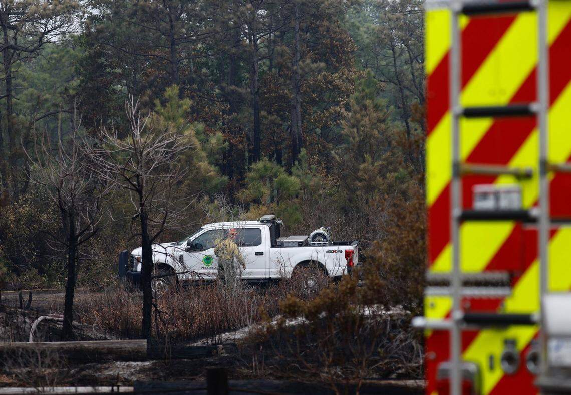 The South Carolina Forestry Commission set up sprinkler systems along the Carolina Forest fire line on Wednesday, March 5, 2025