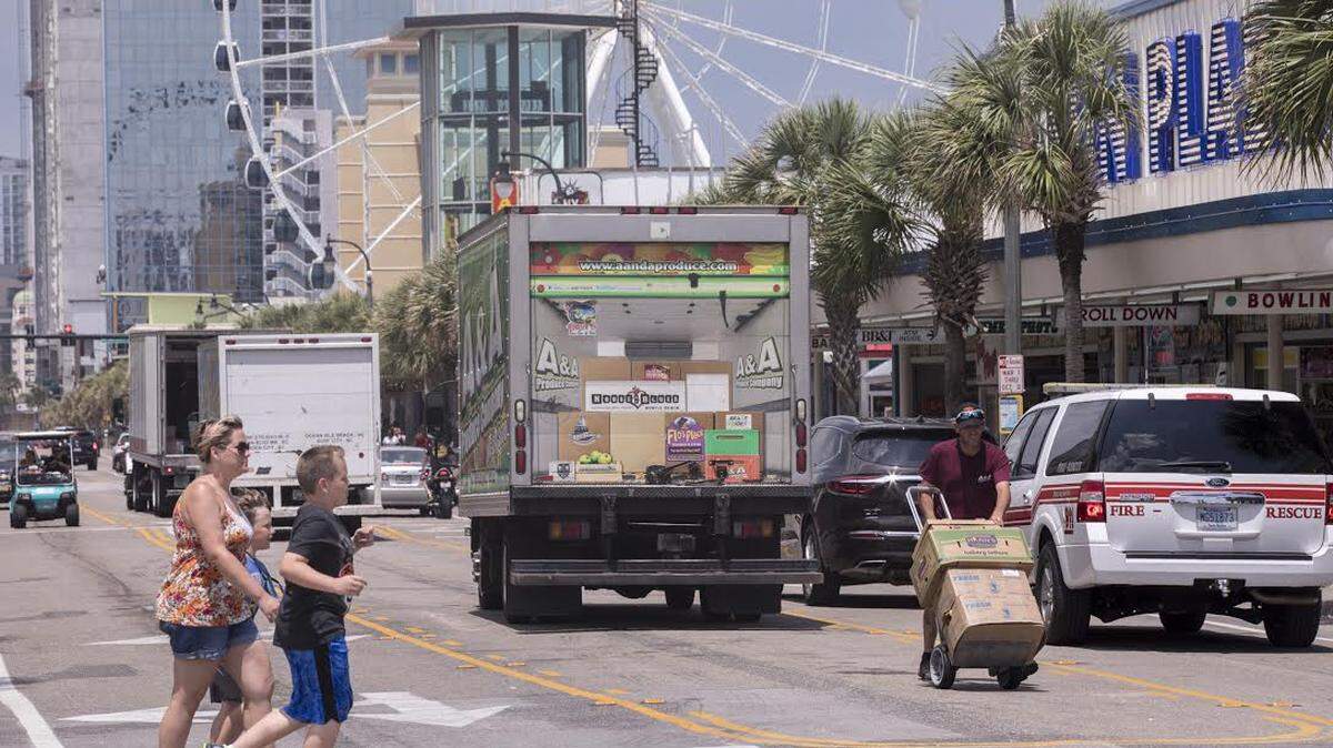 File art for Ocean Boulevard and Pavilion section of Myrtle Beach includes Coast RTA bus, trolley, tourist, sidewalk, art, police, golf cart, teenagers, visitors, landmarks, etc.
June 14, 2018.