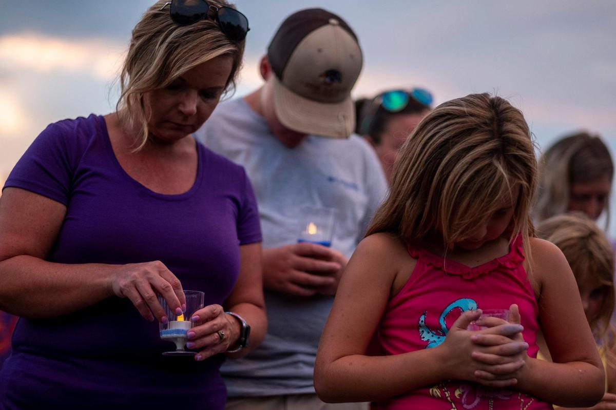 A vigil was held for Laura Ashlee Anderson and her step-father Nicholas Wall on Monday. The pair were shot and killed last week near Andrews, S.C. following a car accident. Ty Sheem Ha Sheem Walters III, 23, of Moncks Corner has been charged in their murders. August 31, 2020.