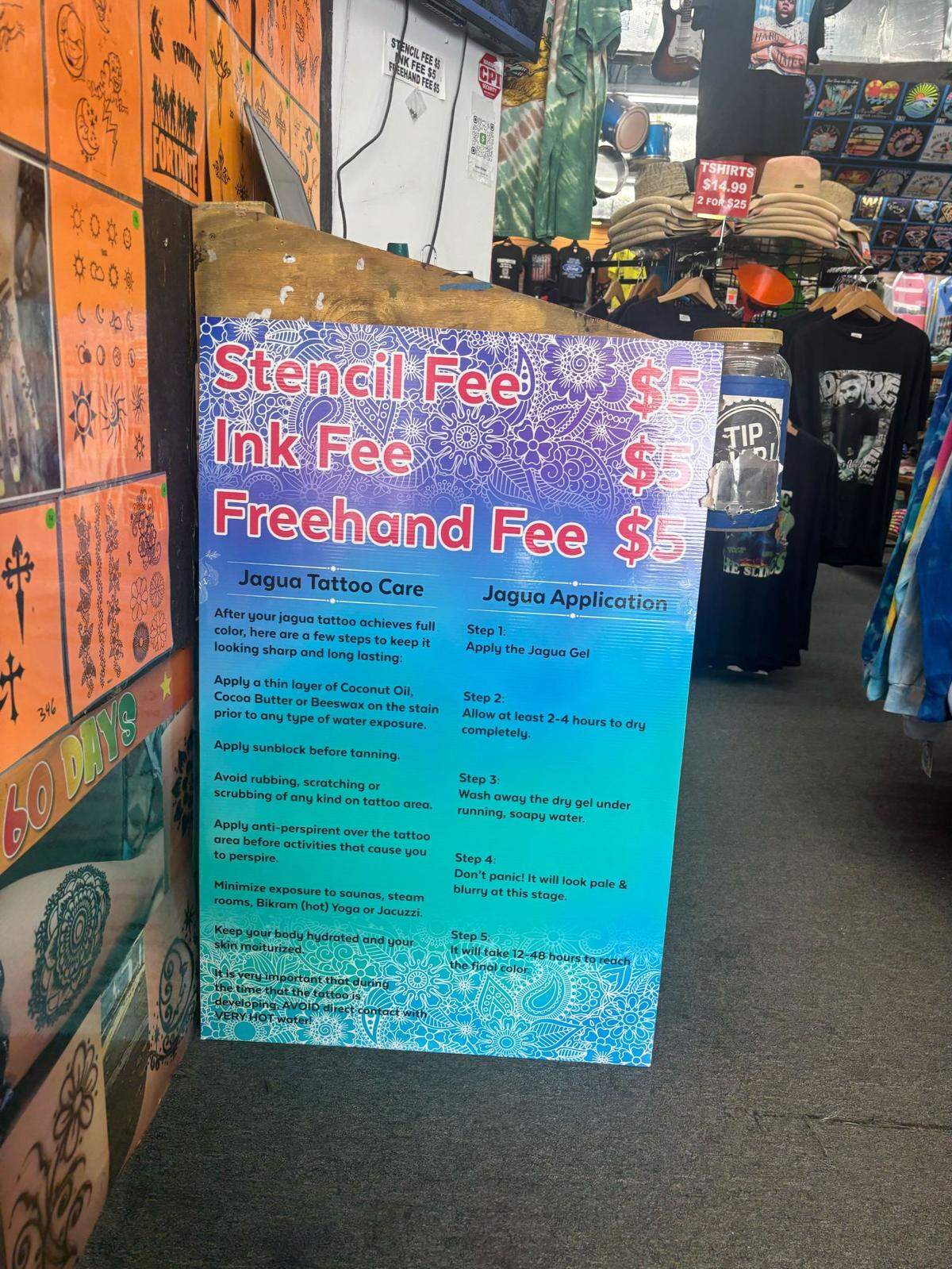 A sign detailing instructions care for a henna tattoo and additional fees at University of Rock and Roll in downtown Myrtle Beach. April 21, 2025