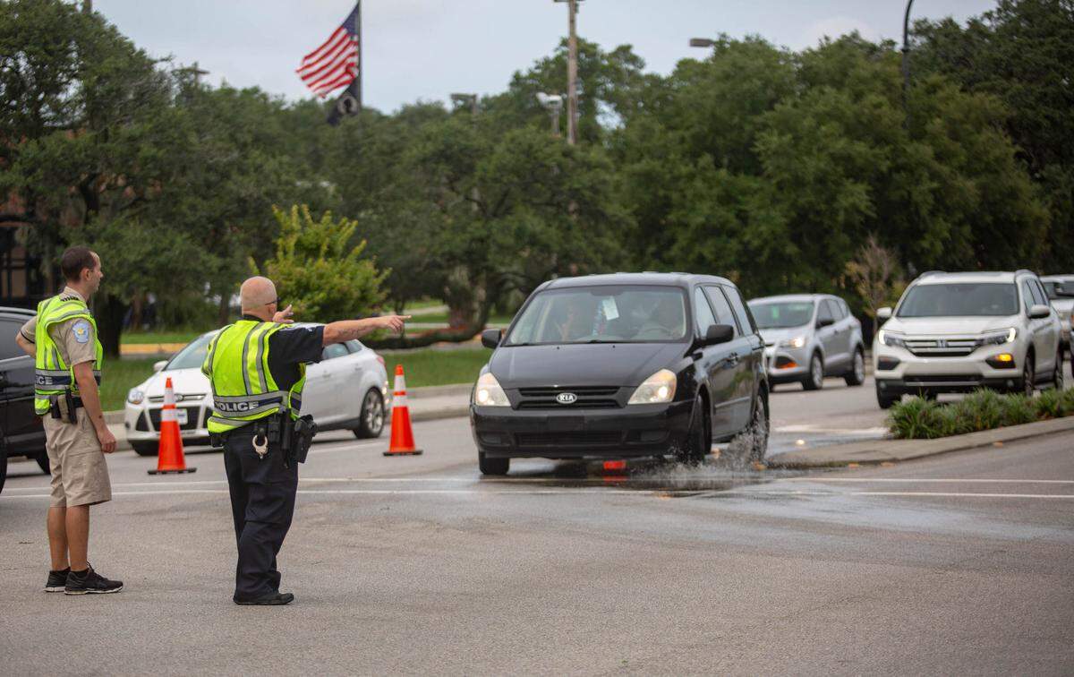 A Myrtle Beach police officer directs traffic  after a bicyclist was hit by a car around 3:15 p.m. at the corner of 5th Ave. N. and Kings Hwy. in Myrtle Beach on Friday.