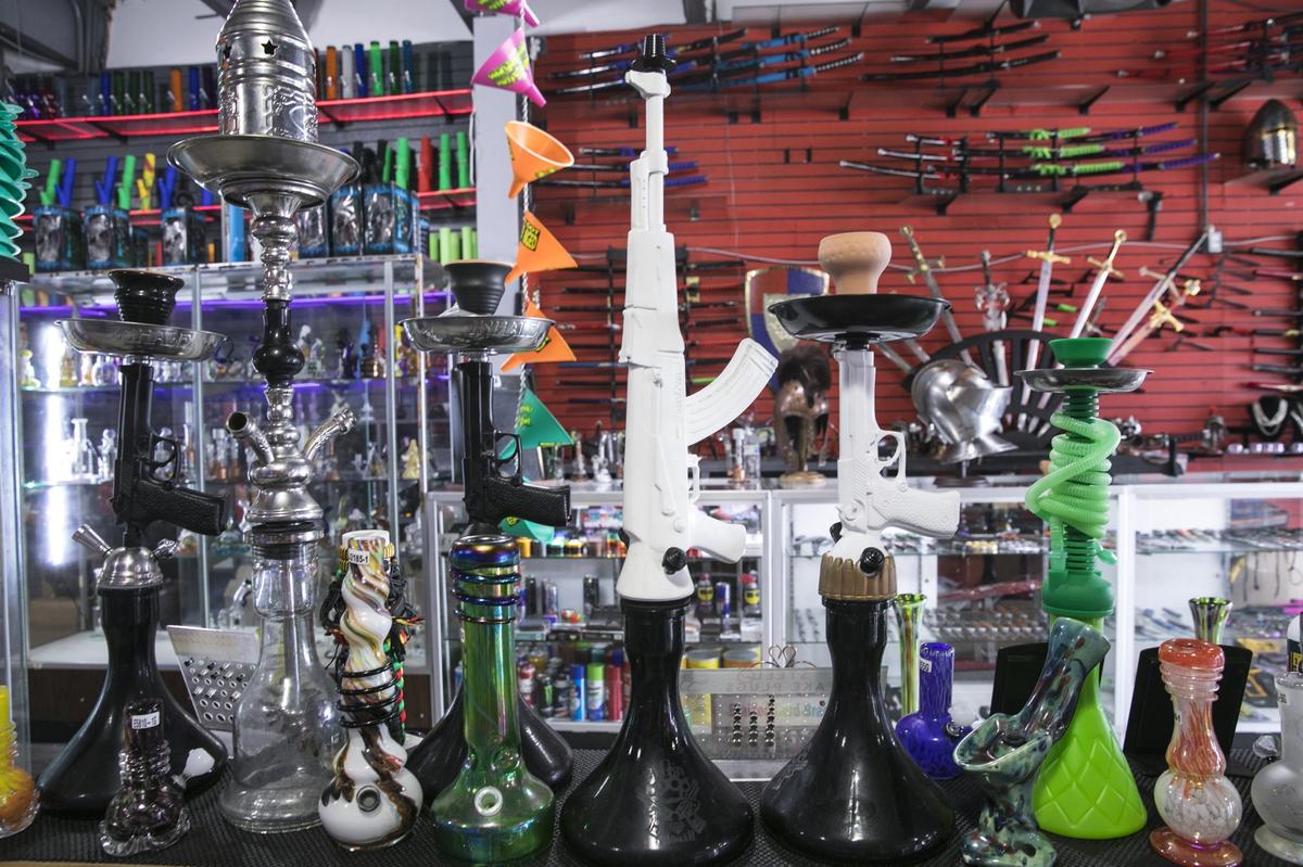 Water pipes shaped like guns, along with a display of swords are for sale at The Rasta Shop on Ocean Boulevard. The City of Myrtle Beach city council plans to vote Tuesday on a new “entertainment overlay district” that would ban the sell of merchandise such as, CBD oil, smoke shop paraphernalia and sexually oriented clothing. Aug, 13 2018.