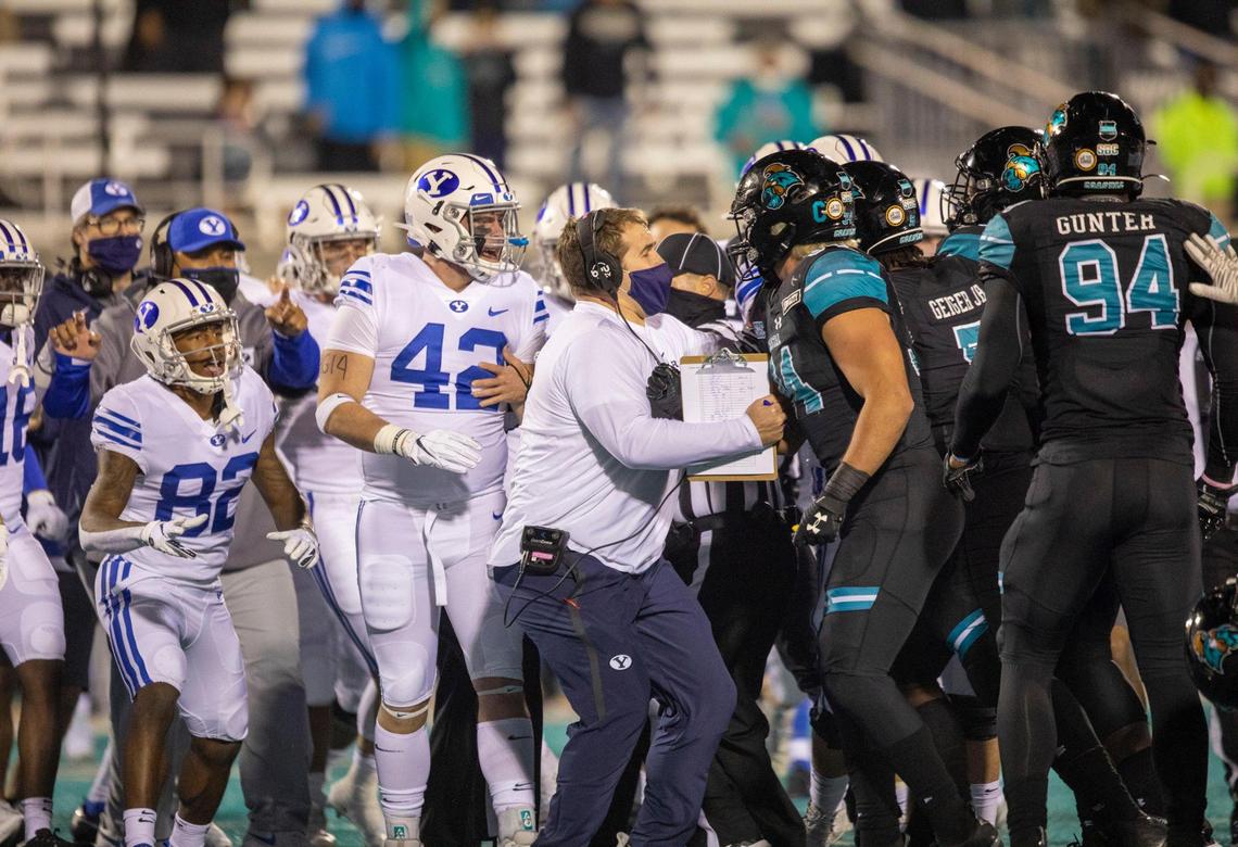A fight clears both sidelines at the end of the first half of play on Saturday night. Coastal Carolina University, ranked #14, takes on #8 ranked Brigham Young University at Brooks Stadium in Conway, S.C. December 5, 2020.