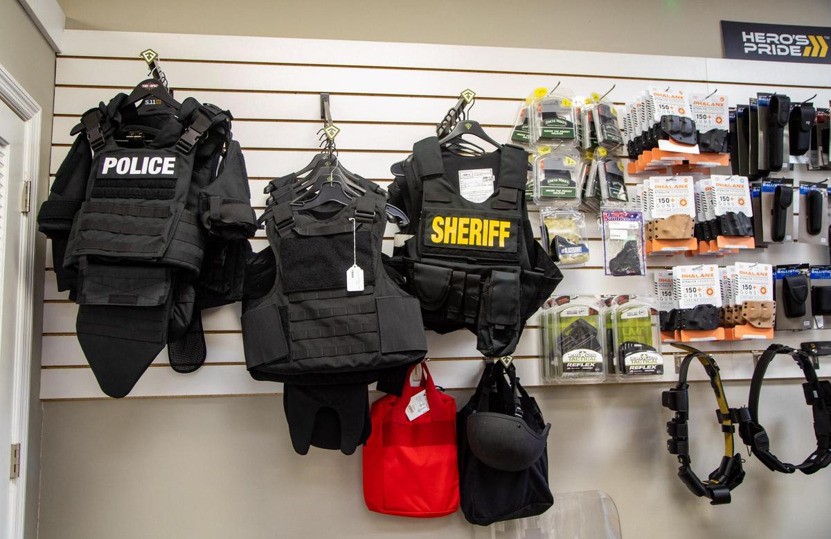 Police tactical vests hang in the corner of Cormac Arms & Outfitters on 38th Avenue in Myrtle Beach. In addition to gun sales and apparel, the new tactical shop supplies law enforcement agencies with tactical gear.