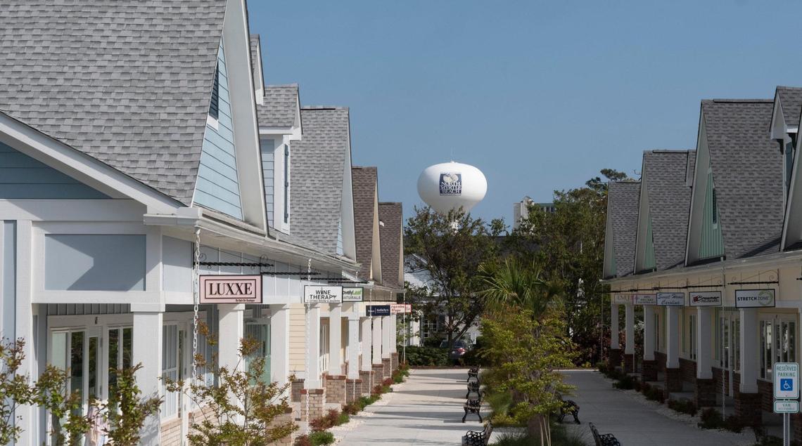 The Shops on Main shopping center on Main Street in North Myrtle Beach has 31 businesses in seven cottage-style buildings and more than 200 parking spaces on a six-acre piece of land. The center has retail businesses, services and restaurants. April 14, 2021.