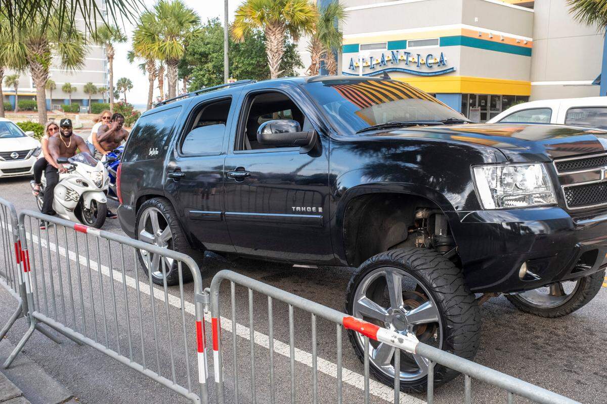 Modified trucks and motorcycles cruise Ocean Boulevard in Myrtle Beach. On boats, beaches and the boulevards, tourists and residents enjoy the first days of the summer season on the Grand Strand during Memorial Day weekend 2021. May 29, 2021.