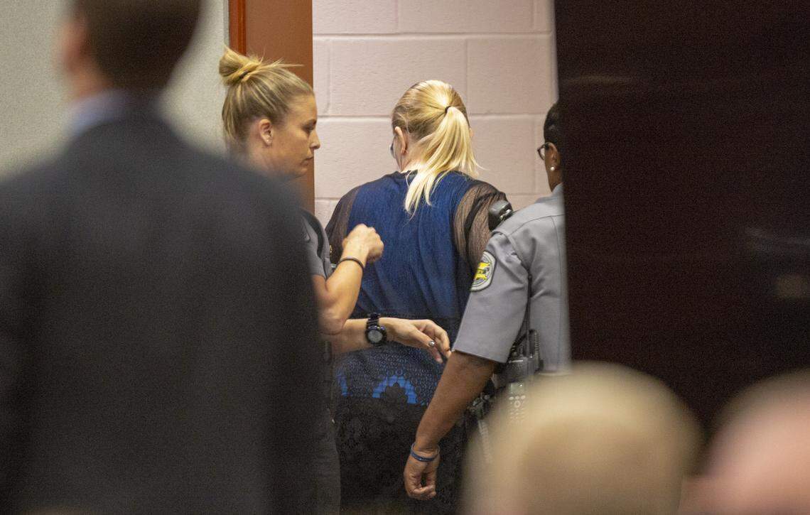 Tammy Moorer is led back to a holding cell Tuesday after Judge Benjamin Culbertson sentenced her to 30 years in prison for kidnapping and conspiracy related to the 2013 disappearance of Heather Elvis.